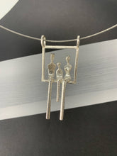 Load image into Gallery viewer, A mother and father with child in a swing in silver