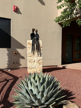 Load image into Gallery viewer, A modern black metal sculpture of two abstract figures
