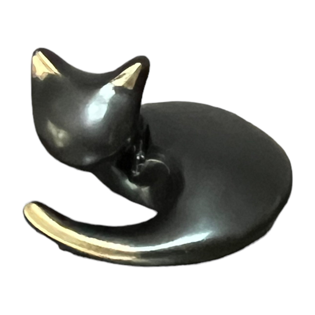 Bronze Curled up cat