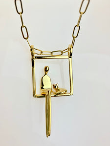 Woman with cat pendant in gold plated silver.